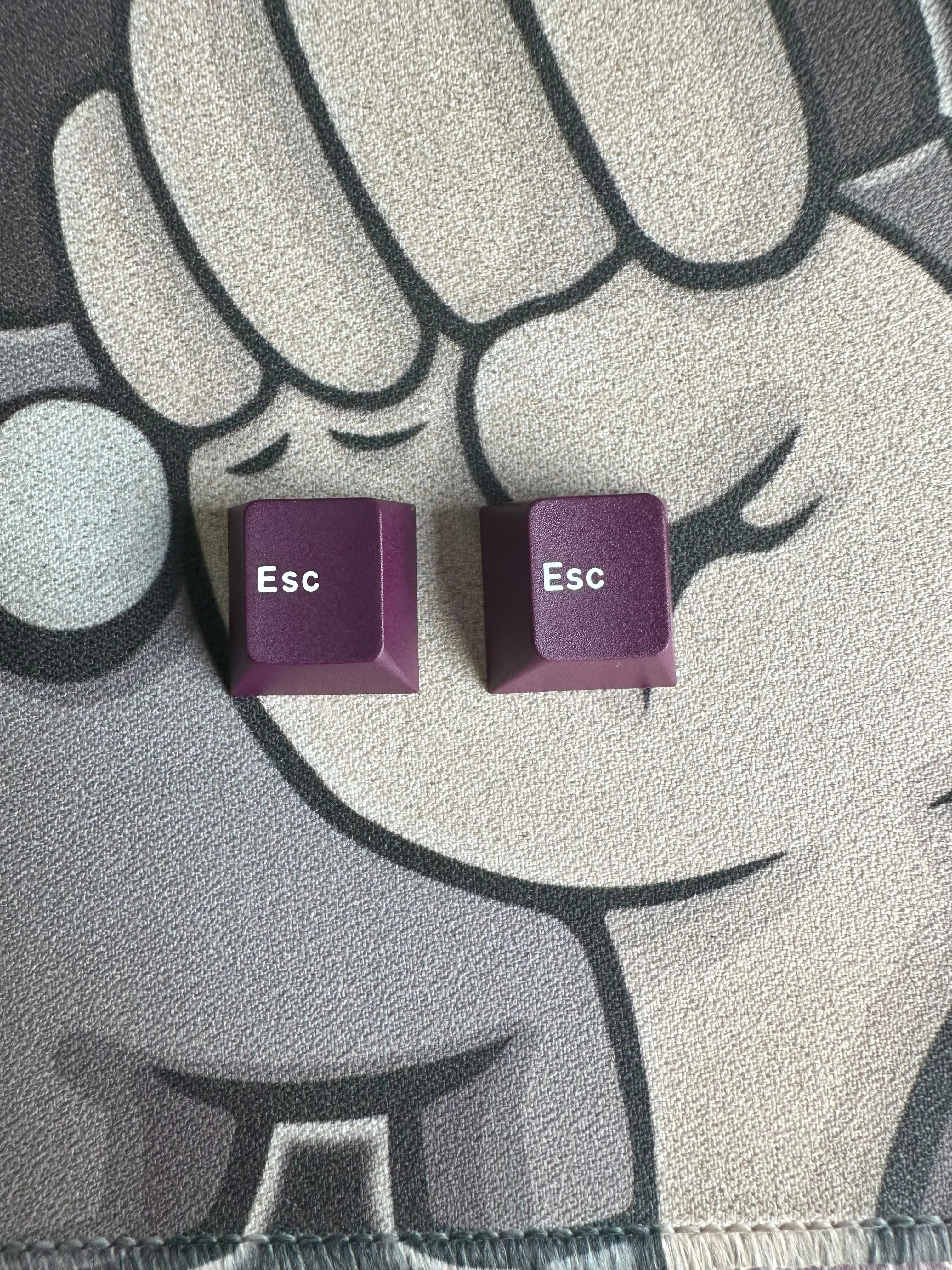 On the second photo, GMK on the right, Keykobo on the left